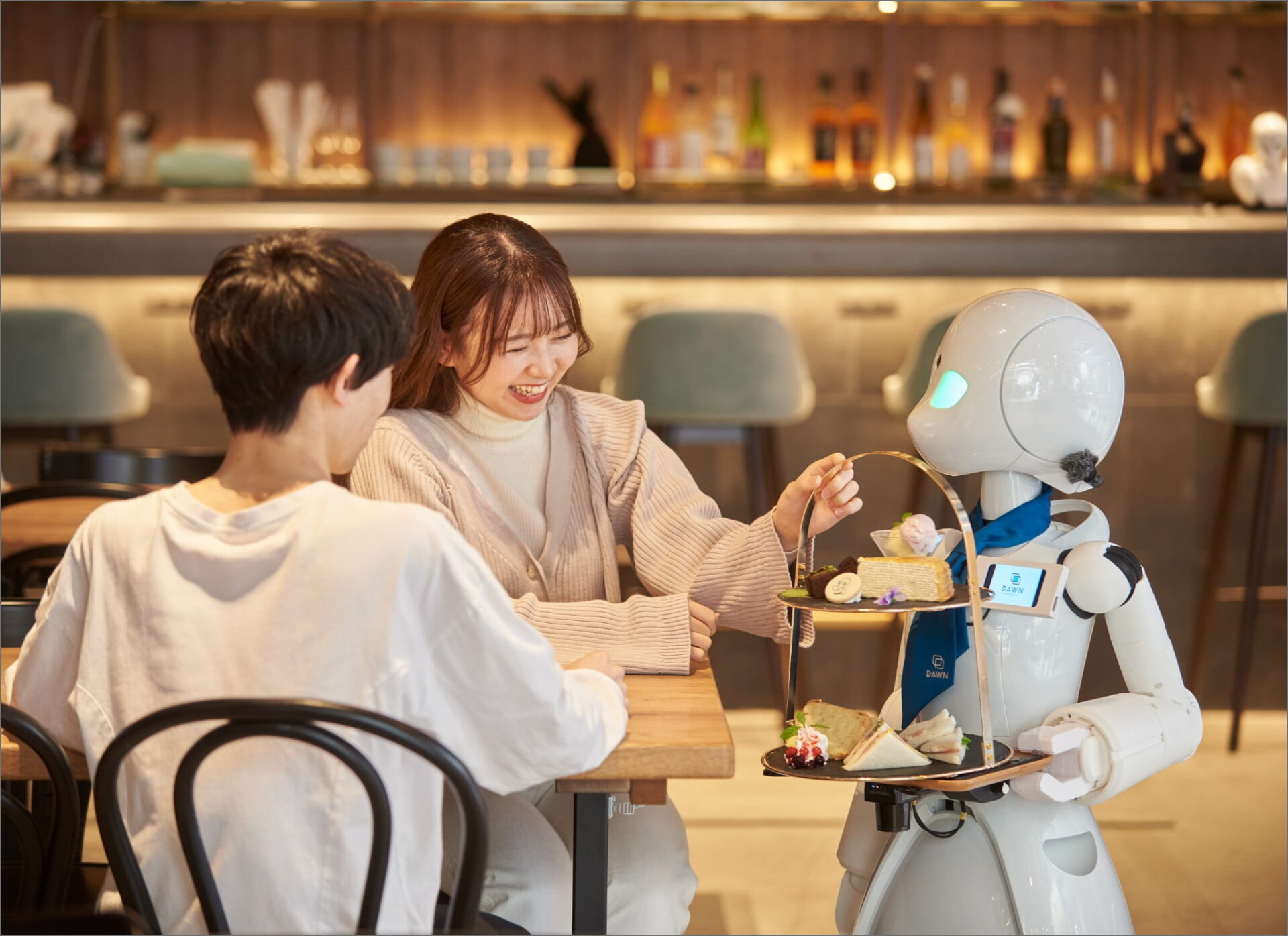 people smiling talking to a robot